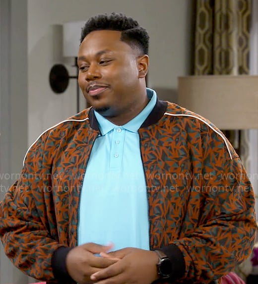 Marty's orange printed bomber jacket on The Neighborhood