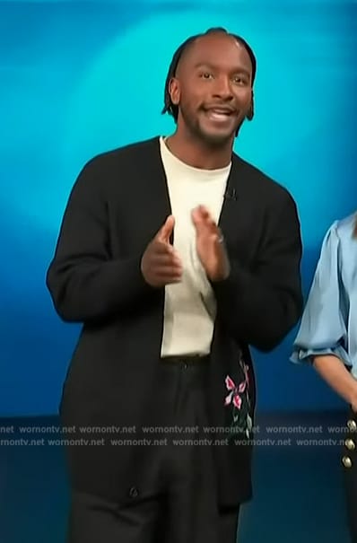 Scott's black floral print cardigan on Access Hollywood