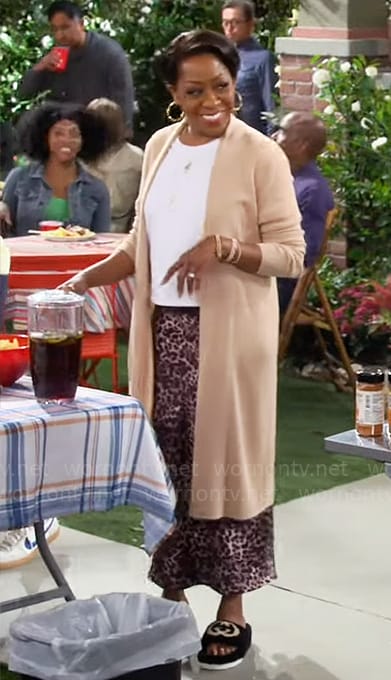 Tina's rhinestone studded t-shirt and leopard print skirt on The Neighborhood