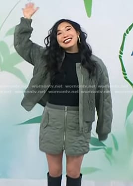 Awkwafina's green quilted bomber jacket and zip front mini skirt on Today