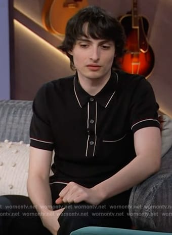 Finn Wolfhard's black contrast trim polo on The Kelly Clarkson Show