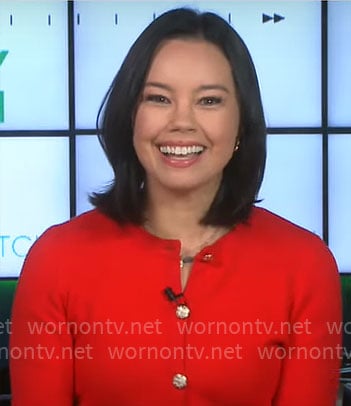 Jo Ling Kent's red cardigan with gold buttons on CBS Evening News