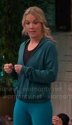 Kristen's teal green cross front hoodie on Extended Family