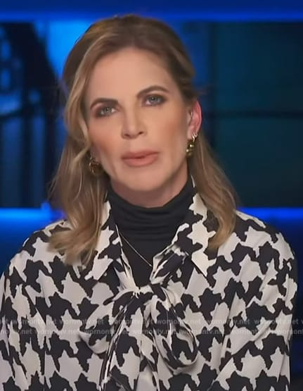 Natalie Morales' houndstooth print tie neck blouse on Access Hollywood