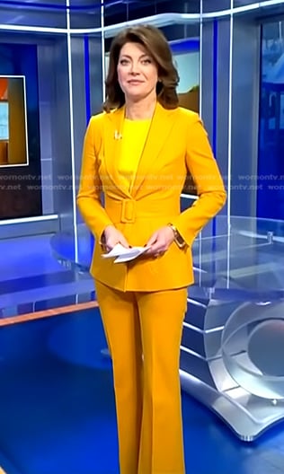 Norah's yellow belted suit on CBS Evening News