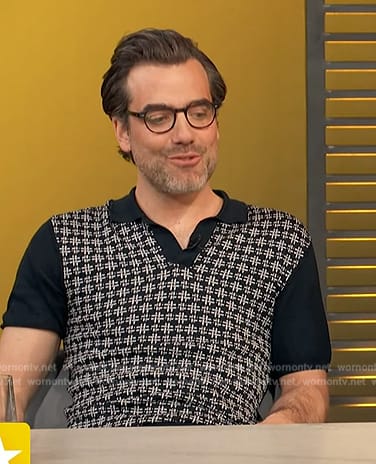 Daniel Ings's black polo on Access Hollywood