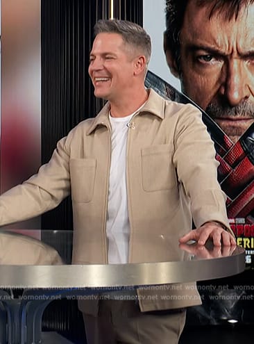 Jason's beige jacket on E! News
