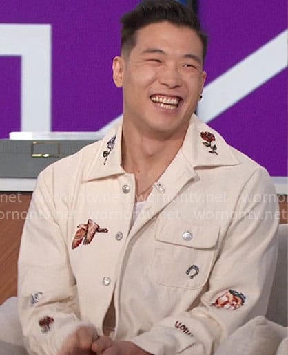 Joel Kim Booster's jacket and pants with patches on The Talk