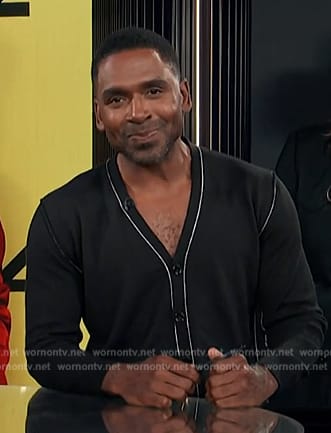 Justin's black contrasting cardigan on E! News