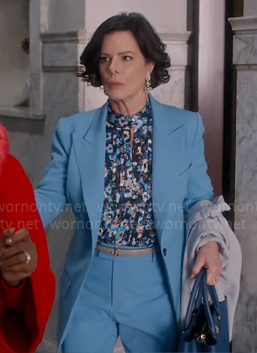 Margaret's floral pleated blouse and blue suit on So Help Me Todd