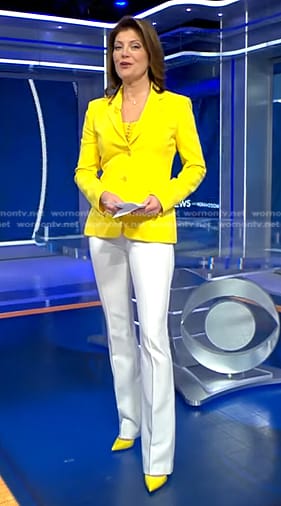 Norah's yellow blazer and white flare pants on CBS Evening News