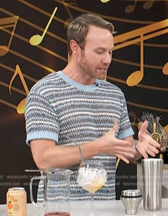 Paul Zahn's blue knit short sleeve sweater on Access Hollywood