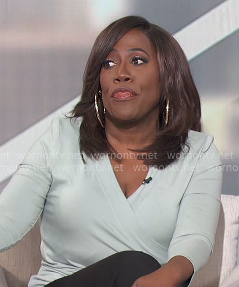 Sheryl's sage green wrap top on The Talk