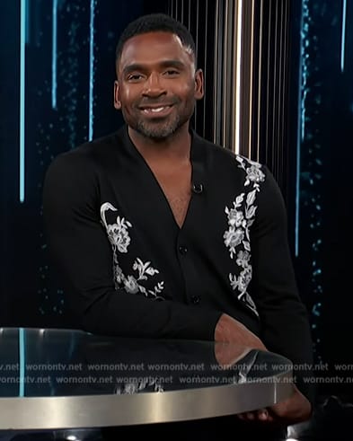 Justin's black embroidered cardigan on E! News