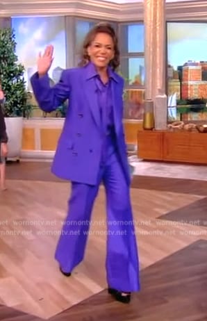 Sunny's purple tie neck blouse and blazer on The View