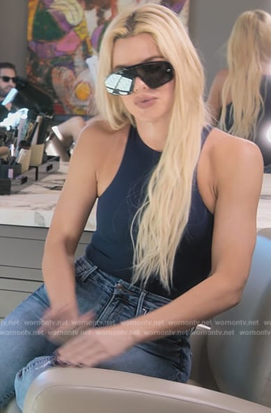 Khloe's navy bodysuit and distressed jeans on The Kardashians