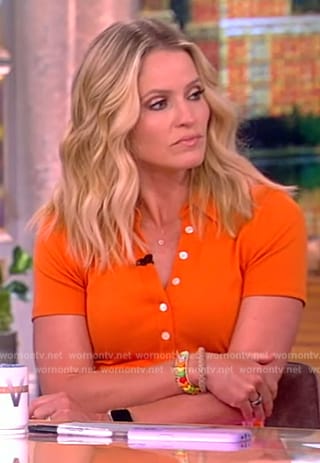 Sara's orange polo and floral skirt on The View