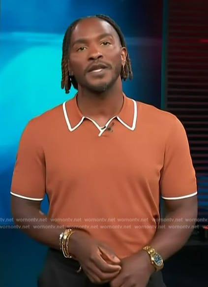 Scott's orange ripped polo on Access Hollywood