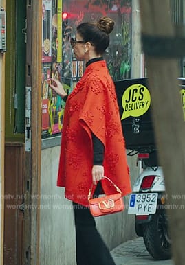 Carmen's red floral cape on Elite