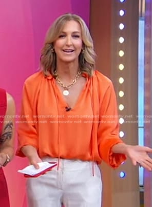 Lara's orange satin blouse on Good Morning America