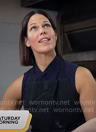 Dana Jacobson's navy sleeveless cross neck top on CBS Mornings
