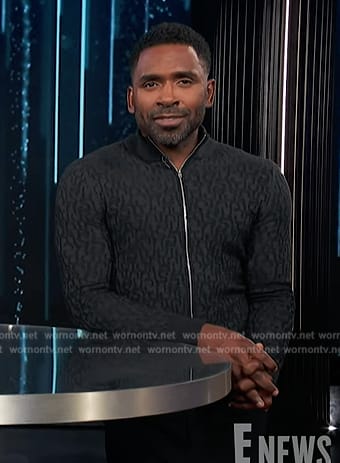 Justin's black textured zip cardigan on E! News