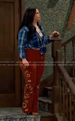 Lou's blue plaid shirt and brown sunflower flare pants on Bunkd