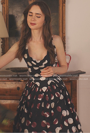 Emily's black polka dot dress on Emily in Paris