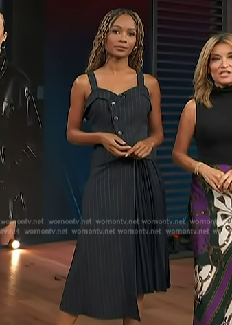 Zuri's navy pinstripe top and pleated skirt on Access Hollywood