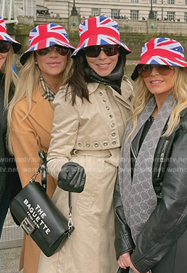 Heather's white leather grommet trench coat on The Real Housewives of Orange County
