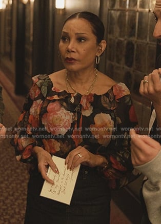 Inez's black floral print off shoulder top on Only Murders in the Building