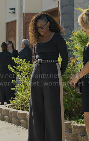 Izzy's black wide leg pants with side stripe on The Lincoln Lawyer