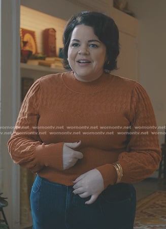 Megan's orange ribbed sweater on American Horror Stories