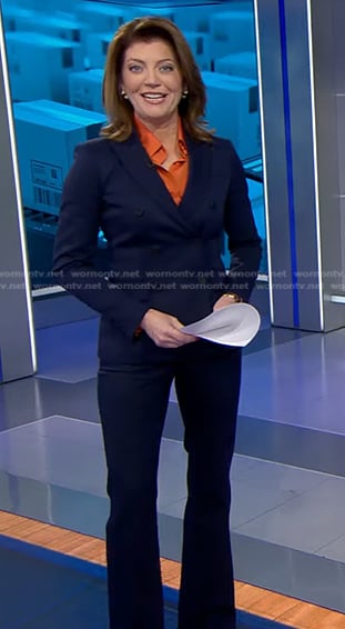 Norah's navy double breasted blazer and pant suit on CBS Evening News