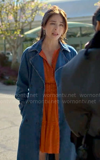 Cassandra's orange dotted dress on Murder in a Small Town
