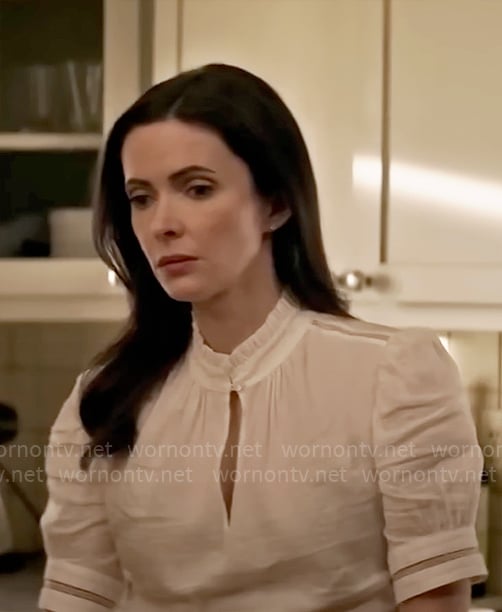Lois's white keyhole top on Superman and Lois