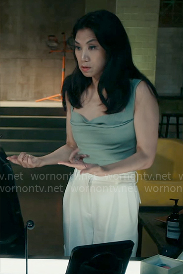 Mel's green tank top and white cargo pants on The Equalizer