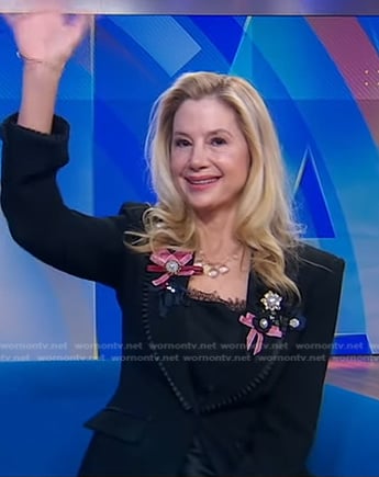 Mira Sorvino's black ribbon embellished blazer on Good Morning America