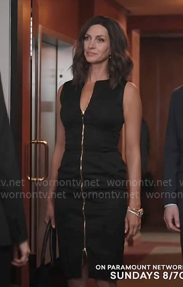 Sarah's black zip-front dress and grommet trim bra on Yellowstone