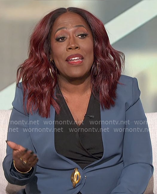 Sheryl's teal blue blazer with gold turnlock closure on The Talk