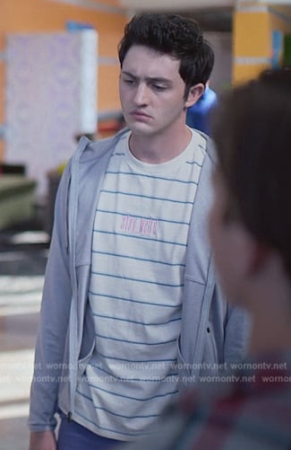 Demetri’s stay weird stripe tee on Cobra Kai