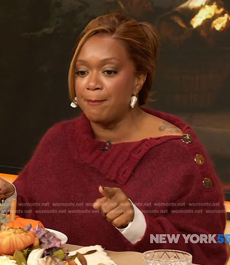 Sunny Anderson's red gold button shoulder sweater on The Drew Barrymore Show