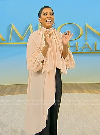 Tamron's pink asymmetric top on Tamron Hall Show