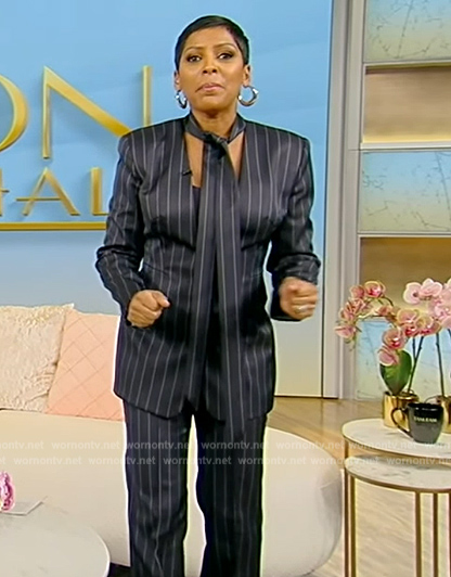 Tamron's navy pinstripe tie neck blazer and pants on Tamron Hall Show