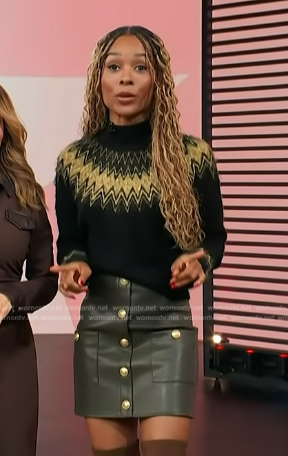 Zuri's black argyle knit sweater and leather mini skirt on Access Hollywood