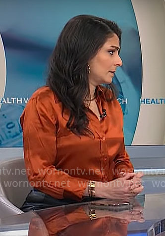 Dr Celine Gounder's orange button down blouse on CBS Mornings