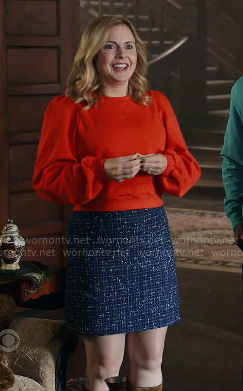 Sam's red sweatshirt and blue tweed skirt on Ghosts
