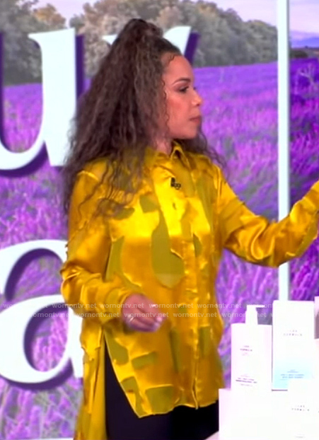 Sunny's yellow abstract satin blouse on The View