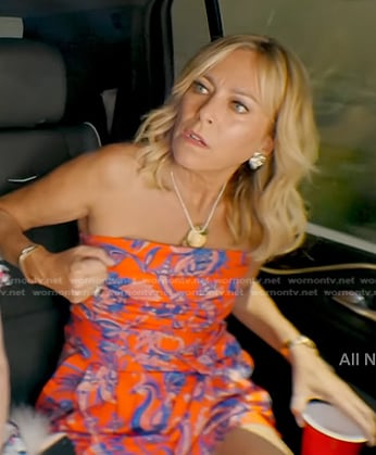 Sutton's orange floral strapless romper on The Real Housewives of Beverly Hills