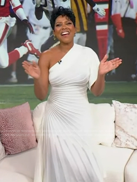 Tamron's white pleated one shoulder dress on Tamron Hall Show